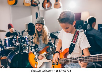 kids rock band in music studio