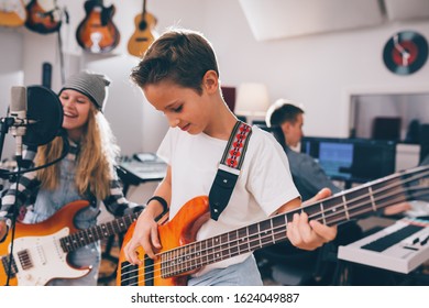 Kids Rock Band Playing In Studio