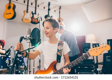 Kids Rock Band Practice In Music Studio