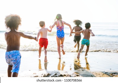 Kids Running At The Beach