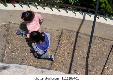 Kids Running Down The Stairs