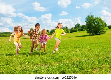 Kids Running In The Park Together 6 And 7 Years Old, Diversity Looking, Boys And Girls Running Together 