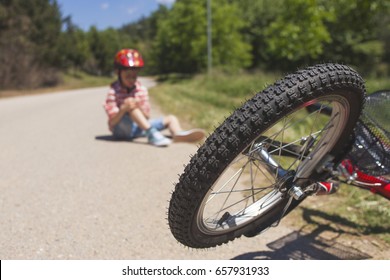 Kids Safety Concept. Bicycle Accident. (Selective Focus Image)