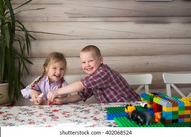 Kids Siblings Brother And Sister Playing In The Constructor, Share Toys, Casual Lifestyle Photo Series In Real Life Interior,