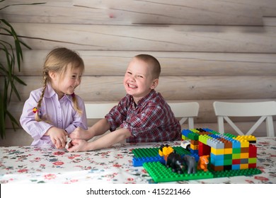 kids siblings brother and sister playing in the constructor, share toys, casual lifestyle photo series in real life interior,