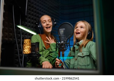Kids singing in record studio - Shutterstock ID 2199862541