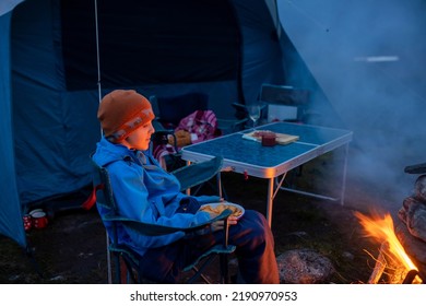 Kids, Sitting Around Campfire At Night, Enjoying Wild Camping, Family Vacation In Norway