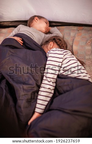 Similar – Image, Stock Photo Happy couple laughing and covering mouths under duvet