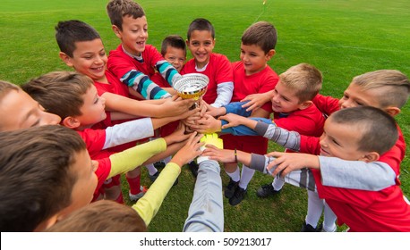 Kids Soccer Football Team In Huddle