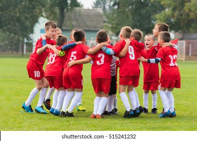 Kids Soccer Football Team In Huddle