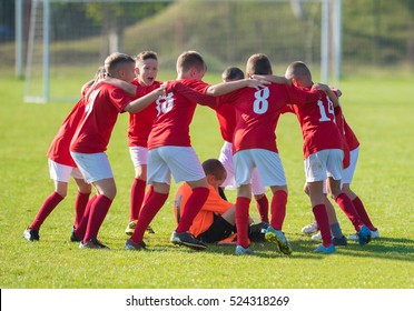 Kids Soccer Football Team In Huddle