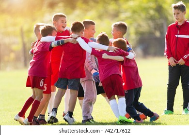 Kids Soccer Football Team In Huddle