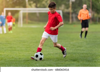 Kids soccer football - young children players match on soccer field  - Shutterstock ID 686063416