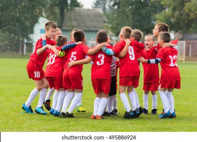 Kids Soccer Team In Group Huddle