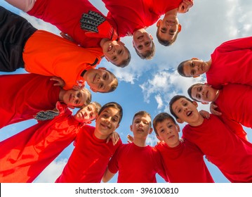 Kids Soccer Team In Huddle