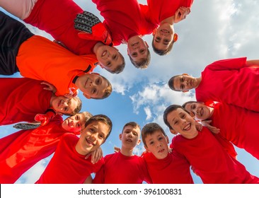Kids Soccer Team In Huddle
