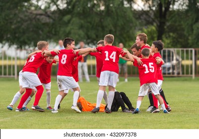 Kids Soccer Team In Huddle