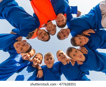 Kids Soccer Team In Huddle