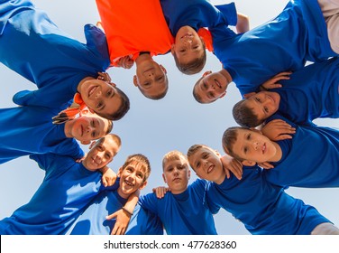 Kids Soccer Team In Huddle