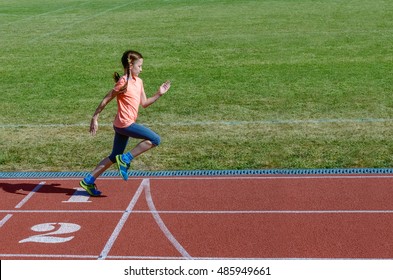 Kids Sport, Child Running On Stadium Track, Training And Fitness Concept
