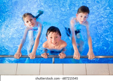 Kids In The Swimming Pool Having Fun
