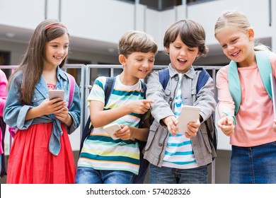 Kids taking selfie with mobile phone on school terrace - Powered by Shutterstock