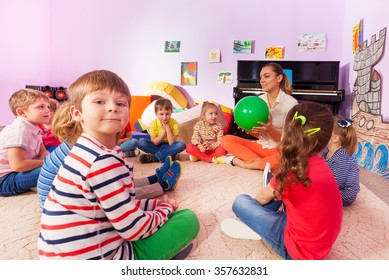 Kids And Teacher Sit In Circle