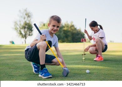 kids teaching to play golf outdoor