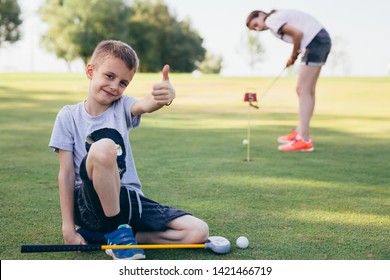 Kids Teaching To Play Golf Outdoor