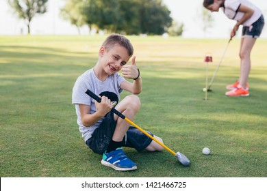 Kids Teaching To Play Golf Outdoor