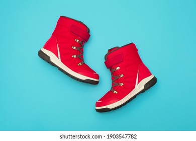 Kids Or Teenage Pink Winter Boots Isolated On Blue Background. Winter Boots For Girls.