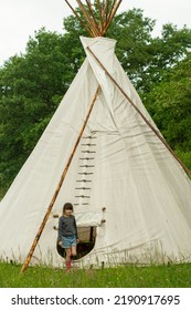 Kids Teepee Tent At Nature Outdoor. Happy Joyful Child Have Fun