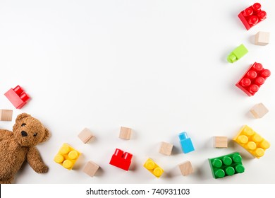 Kids toys background with teddy bear and colorful blocks - Shutterstock ID 740931103
