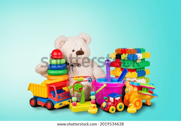 Kids toys collection. Soft bear, baby toys on\
light blue background