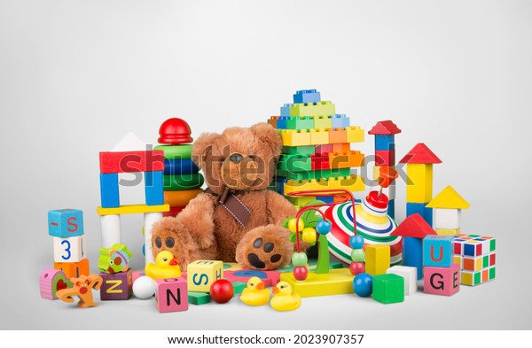 Kids toys collection. Soft bear, baby toys on\
light background