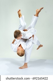 Kids Are Training Throws Of Judo In Judogi