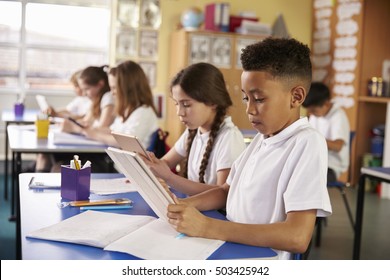 Kids Use Tablet Computers In Primary School Class, Close Up