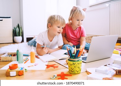 Kids Using Computer Online Technology To Art Creative, Drawing Or Making Crafts. Preschool Children Distance Online Education. Family Leisure With Little Children At Home Or Daycare.