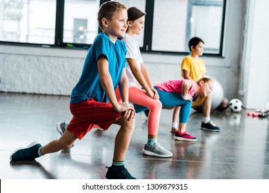 Kids Warming Up Before Training In Gym