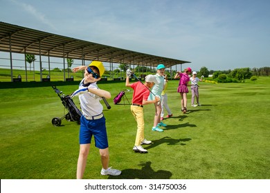 Kids Warming Up At Golf School At Summer Day