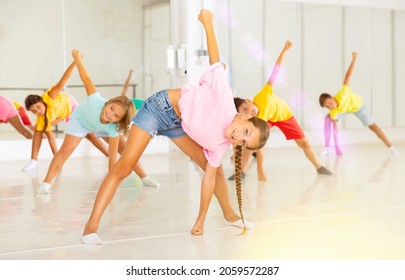 Kids Warming Up In Group Dance Class, Doing Stretching Exercises Before Dance Training