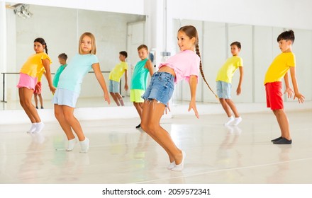 Kids Warming Up In Group Dance Class, Doing Stretching Exercises Before Dance Training