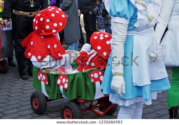 Kids In\
White And Red Fairy Mushroom Costume On The Town Street At A\
Beautiful Happy Carnival Time In Germany,\
Europe.