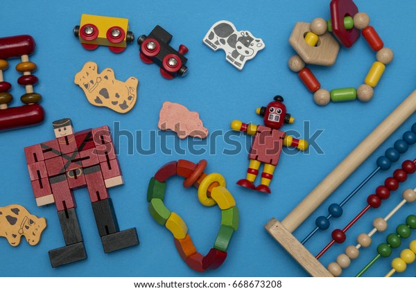 kids wooden toys
scattered on blue
background