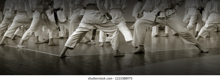 Kids's training on karate-do. Banner with space for text. For web pages or advertising printing. Photo without faces.