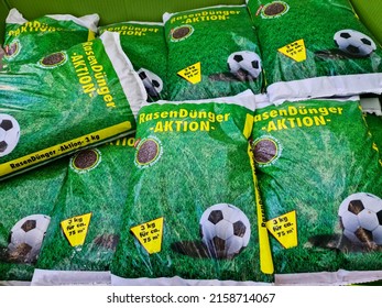 KIEL, GERMANY - Feb 21, 2022: Large Bags Of Lawn Fertilizer With A Soccer Advertisement On It In The Sales Area Of A Garden Center