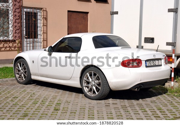 Kielce,\
Świętokrzyskie, Poland- 2020-09-11 - Mazda white little sports car\
(part of registration car erased\
)
