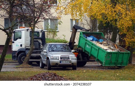 Kielce, Świętokrzyskie, Poland - 2021-11-12 - Hook Lift Truck Lifts The Debris Container