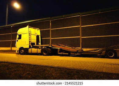 Kielce, Świętokrzyskie, Poland - 2022-04-09 - A Tow Truck Parked In The Street At Night