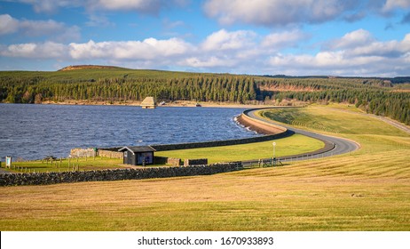 Kielder Dam on a sunny day, at Kielder Water and Forest Park in Northumberland, which has the largest man made lake in Northern Europe. The reservoir sits in the North Tyne Valley